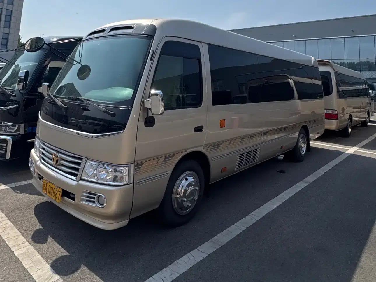 2019 Toyota Coaster 4.0L Luxury SUV GRB53L-ZEMNK 23-seat (no armrests) 9GR — миниатюра 1