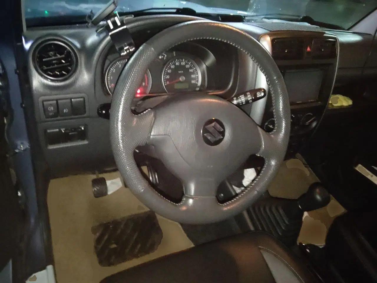 Suzuki Jimny 2012 registration, 1.3L, manual transmission, gasoline, 4 seats (imported) — миниатюра 10